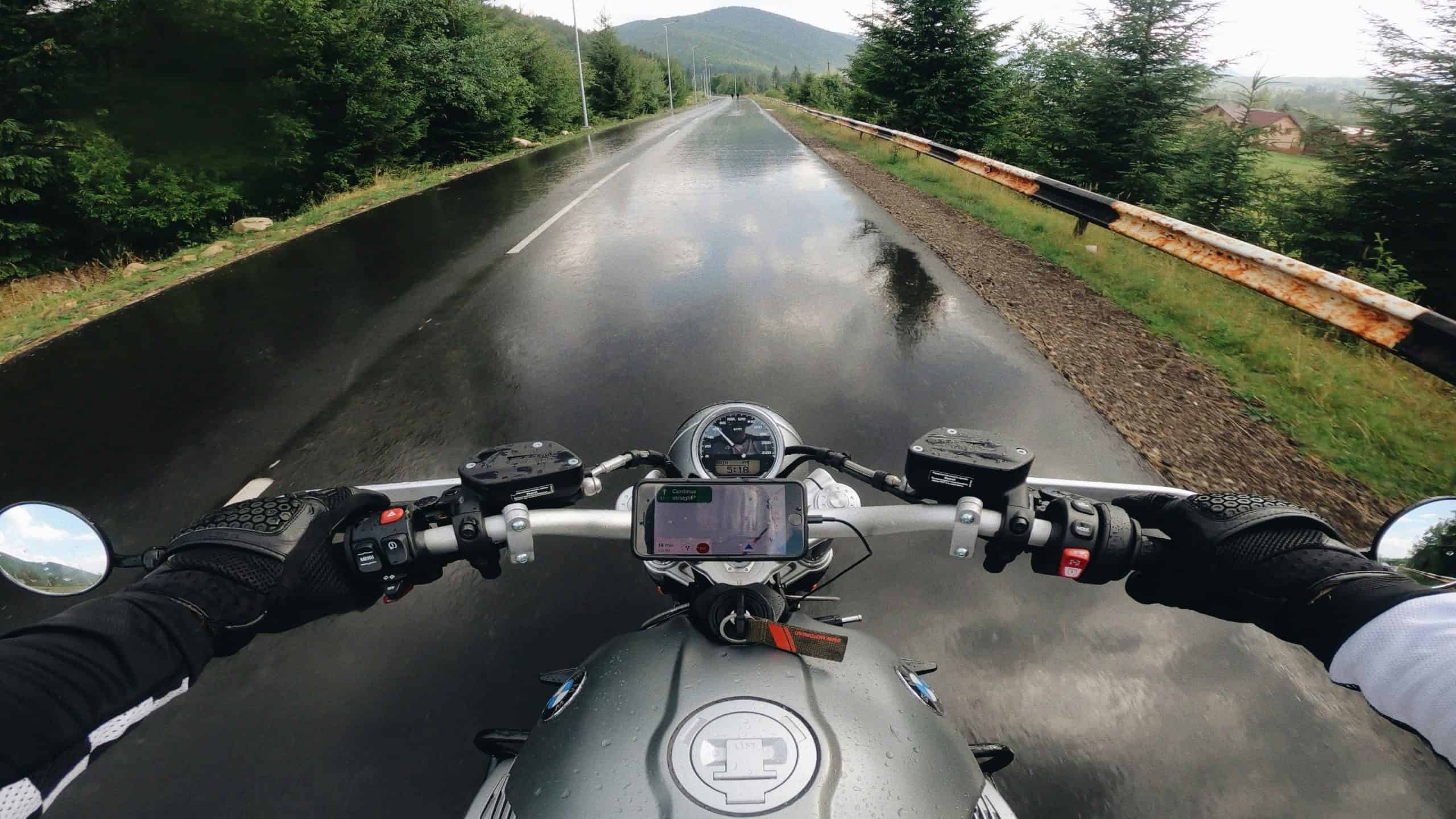 motorcycle rider pov on wet road